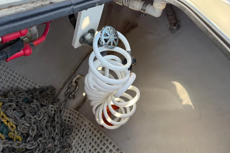 Slide: The Image of Coiled hose and chains in 2005 Sea Ray 48 Sundancer boat compartment. - 30