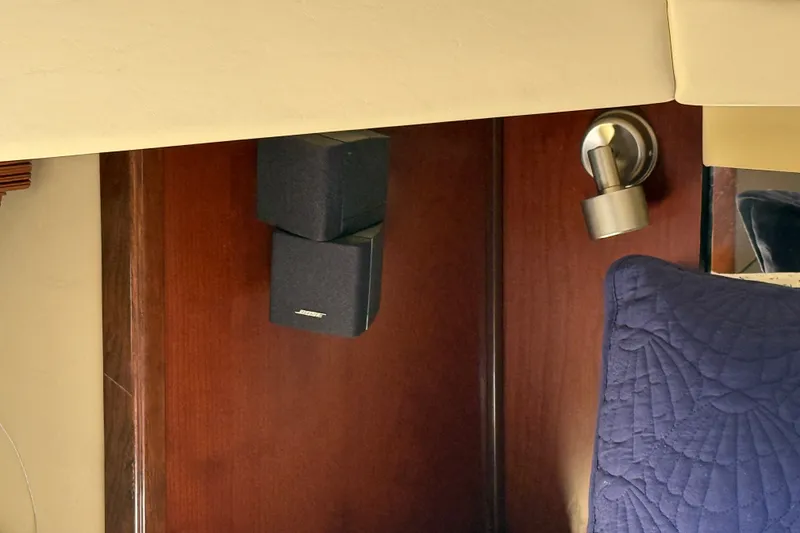 Slide: The Image of Interior of 2005 Sea Ray 48 Sundancer with Bose speakers and wall light fixture. - 54