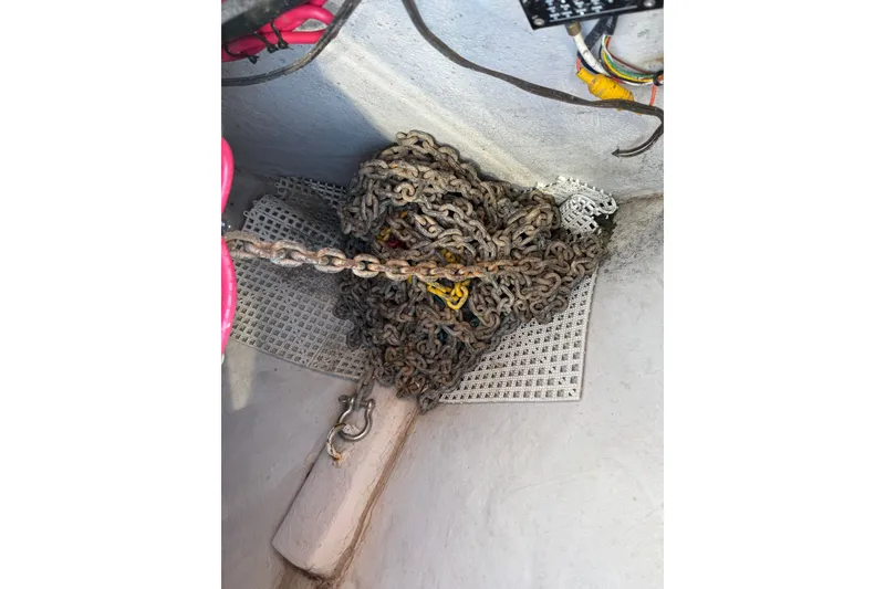 Slide: The Image of Anchor chain storage on 2005 Sea Ray 48 Sundancer boat. - 26