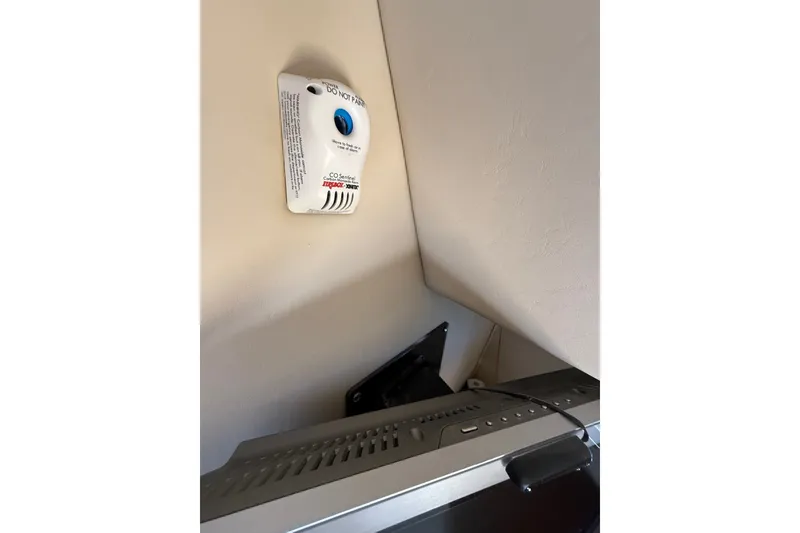 Slide: The Image of Carbon monoxide detector on a 2005 Sea Ray 48 Sundancer yacht interior wall. - 52