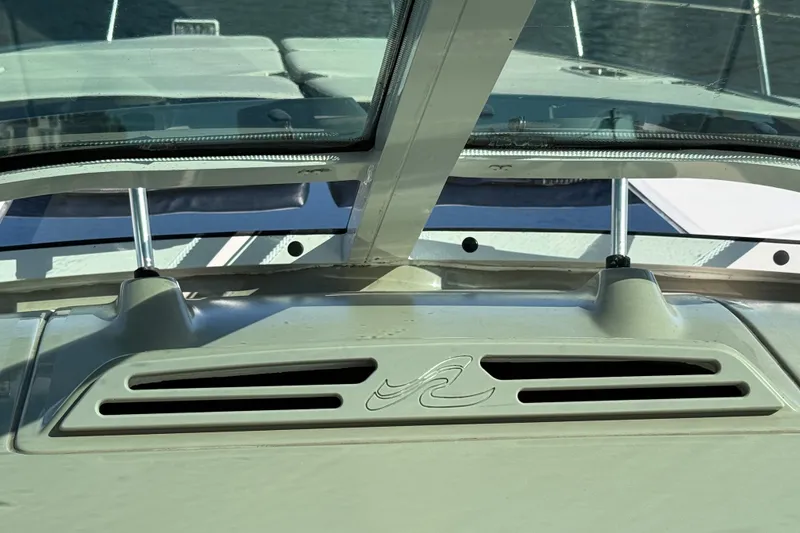 Slide: The Image of 2005 Sea Ray 48 Sundancer windshield and dashboard detail with logo. - 46