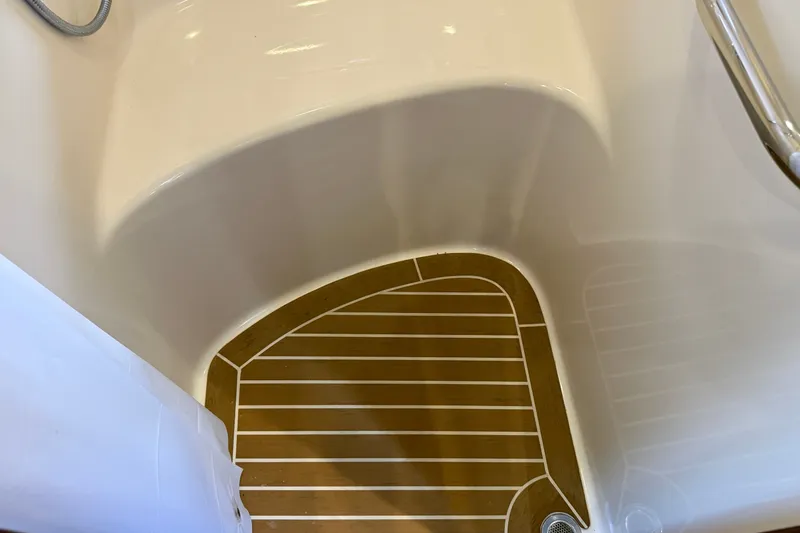 Slide: The Image of Shower area of 2005 Sea Ray 48 Sundancer with teak-style flooring. - 64