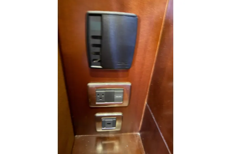 Slide: The Image of Control panel and outlets on 2005 Sea Ray 48 Sundancer yacht interior. - 89