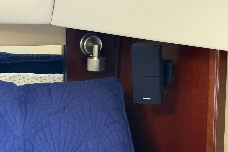 Slide: The Image of Interior of 2005 Sea Ray 48 Sundancer with Bose speaker and blue quilted pillow. - 55