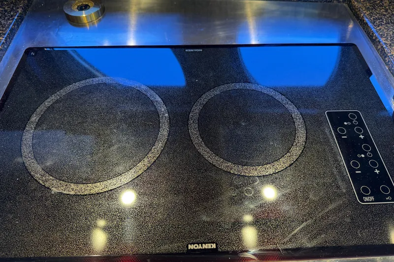 Slide: The Image of Kenyon electric cooktop on 2005 Sea Ray 48 Sundancer yacht kitchen. - 73