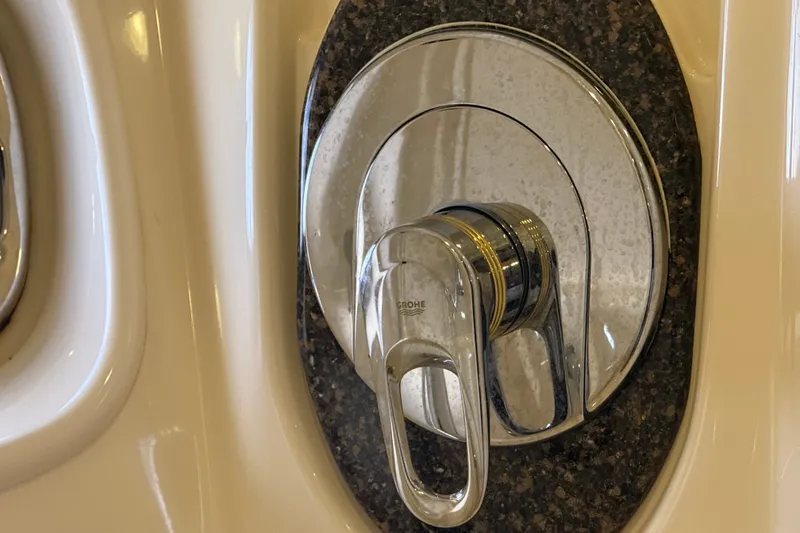 Slide: The Image of Chrome shower control on 2005 Sea Ray 48 Sundancer yacht, featuring sleek design and modern finish. - 63