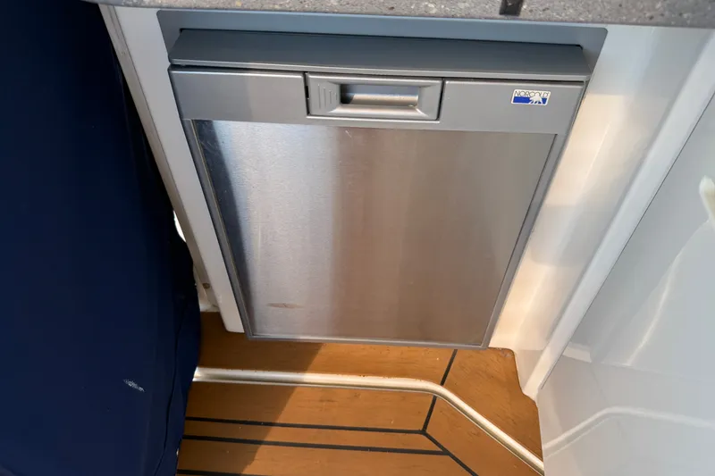 Slide: The Image of Stainless steel refrigerator on 2005 Sea Ray 48 Sundancer yacht interior. - 18