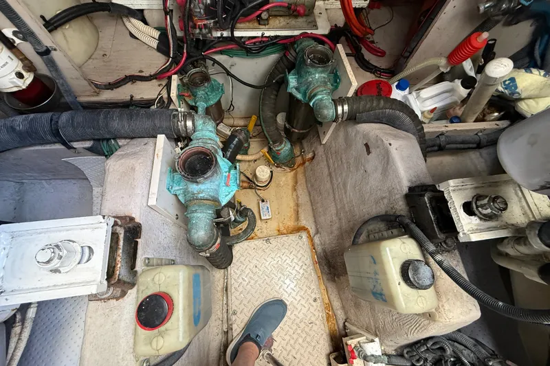 Slide: The Image of Engine room of a 2005 Sea Ray 48 Sundancer with visible mechanical components. - 109
