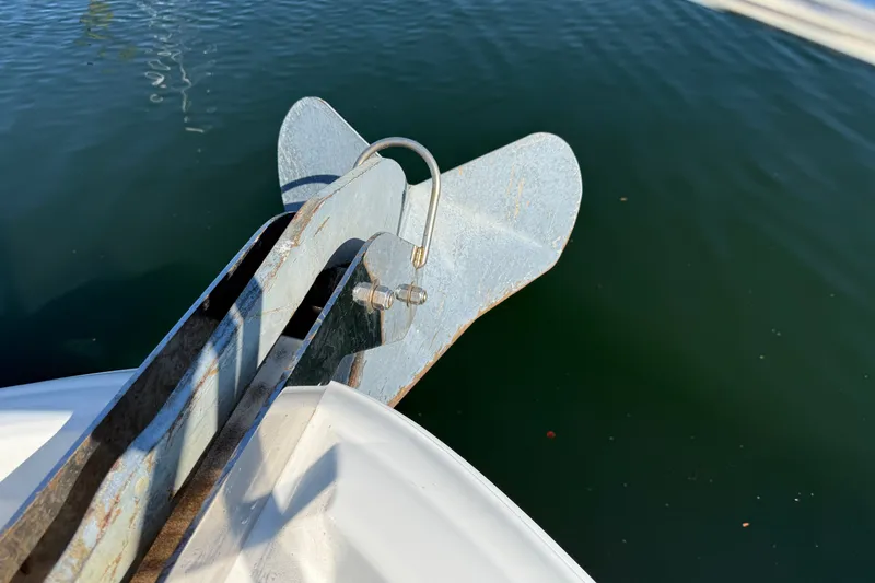 Slide: The Image of Anchor of 2005 Sea Ray 48 Sundancer yacht over calm water. - 28