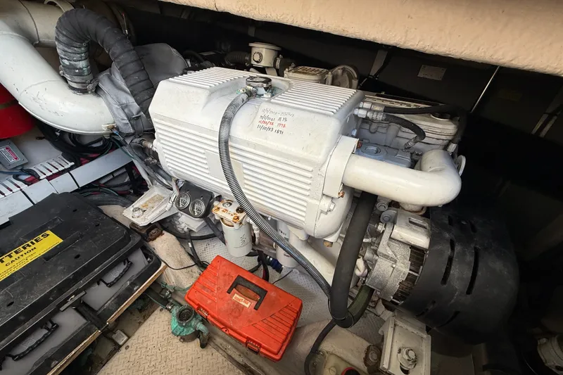 Slide: The Image of Engine compartment of a 2005 Sea Ray 48 Sundancer yacht, showing mechanical components. - 106
