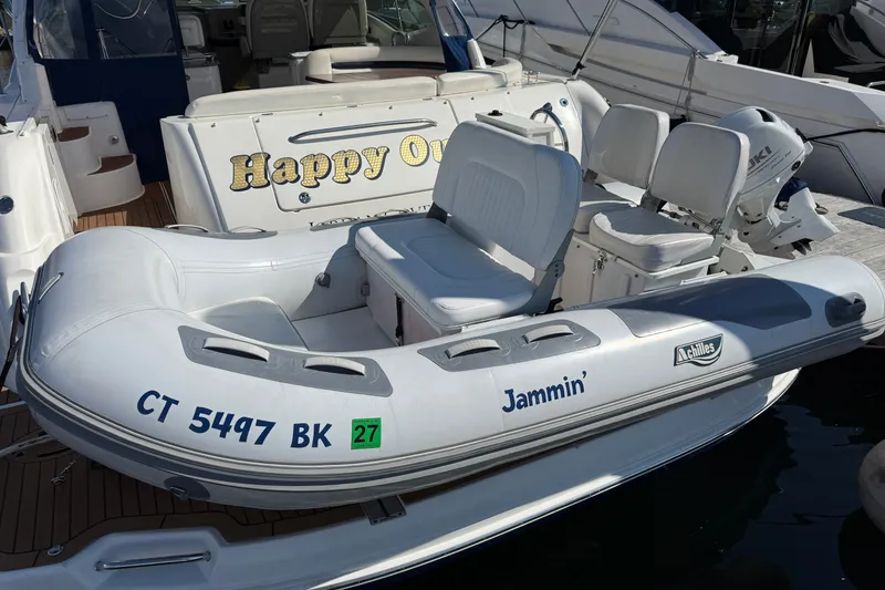 Slide: The Image of Inflatable boat "Jammin'" docked beside 2005 Sea Ray 48 Sundancer yacht "Happy Ours." - 3