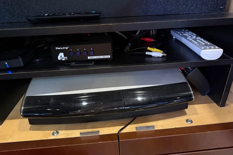 Slide: The Image of Entertainment system with video audio switch and remote control on a Sea Ray 48 Sundancer yacht. - 85