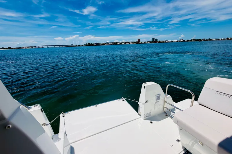 Slide: The Image of 2026 Beneteau Antares 11 boat on serene blue waters under a clear sky. - 12