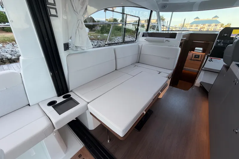 Slide: The Image of Interior of 2026 Beneteau Antares 11, featuring sleek seating and modern design elements. - 38
