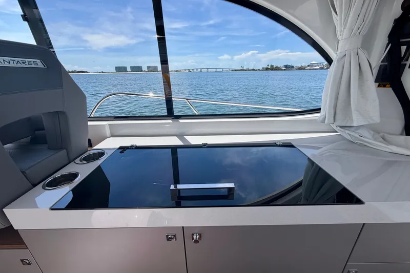 Slide: The Image of Interior view of 2026 Beneteau Antares 11, featuring sleek design and ocean backdrop. - 14