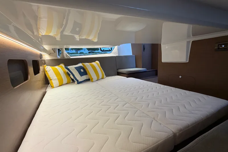 Slide: The Image of Luxurious cabin interior of 2026 Beneteau Antares 11 with cozy bedding and modern design. - 34