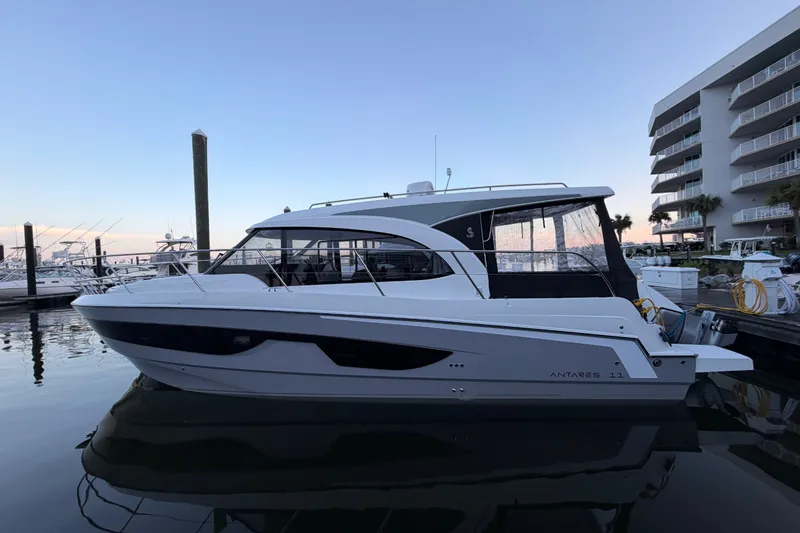 Slide: The Image of 2026 Beneteau Antares 11 yacht docked at marina during sunset. - 40