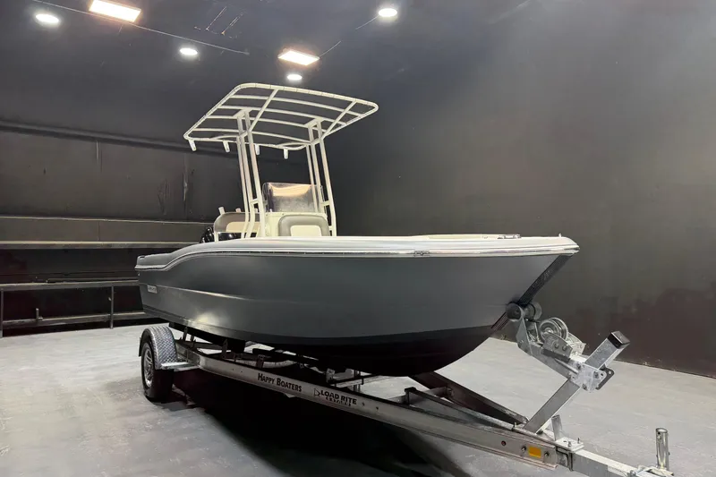 The Image of 2022 Clearwater 2000 Center Console boat on trailer in indoor setting. - 0