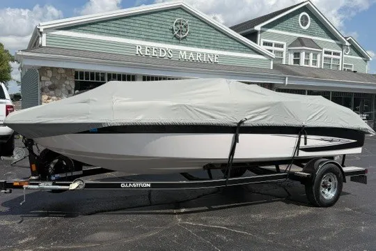 Slide: The Image of 2011 Glastron GT 205 boat covered on trailer at Reed's Marine. - 33