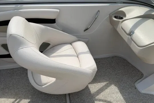 Slide: The Image of 2011 Glastron GT 205 boat interior with white captain's chair and sleek design. - 28