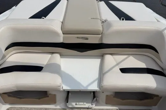 Slide: The Image of 2011 Glastron GT 205 boat seating area with beige and black upholstery. - 29