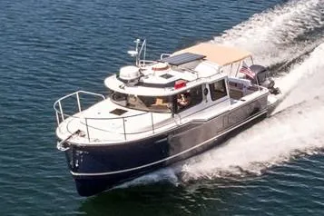 Slide: The Image of Manufacturer Provided Image: 2024 Ranger Tugs R-27 cruising on open water. - 58