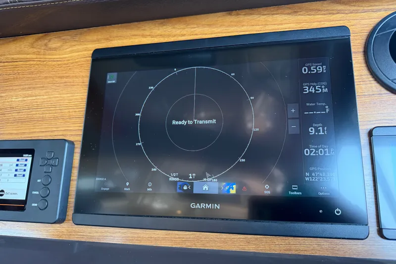 Slide: The Image of Garmin navigation display on 2024 Ranger Tugs R-27 boat dashboard. - 28