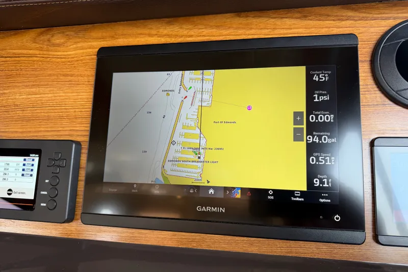 Slide: The Image of Garmin navigation display on 2024 Ranger Tugs R-27 boat dashboard. - 27