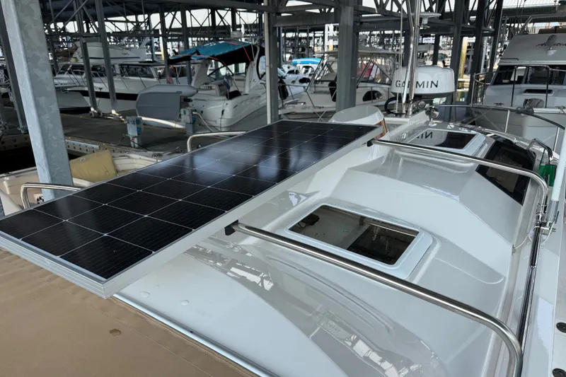 Slide: The Image of 2024 Ranger Tugs R-27 with solar panel on deck in marina. - 56