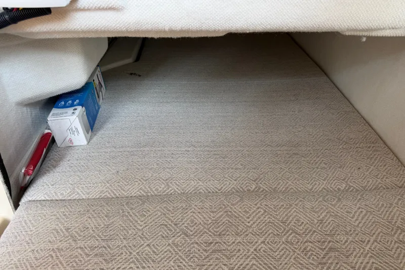 Slide: The Image of Interior storage space of 2024 Ranger Tugs R-27 boat with carpeted flooring. - 52