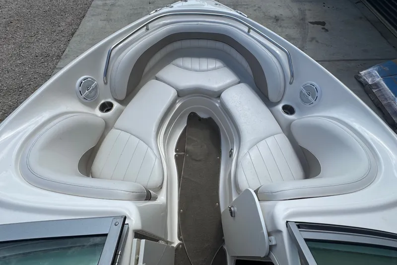 Slide: The Image of 2007 Kayot Z 220 boat interior with white cushioned seating and built-in speakers. - 5