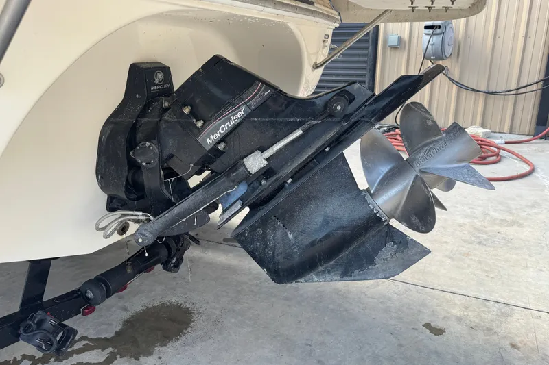 Slide: The Image of 2007 Kayot Z 220 boat with MerCruiser outdrive and propeller in a garage setting. - 15