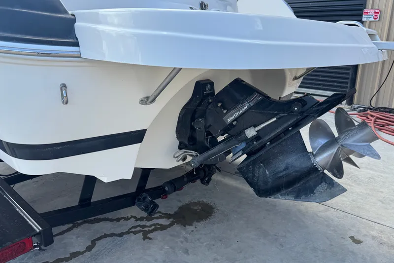Slide: The Image of 2007 Kayot Z 220 boat with MerCruiser outdrive and dual propellers on a trailer. - 16