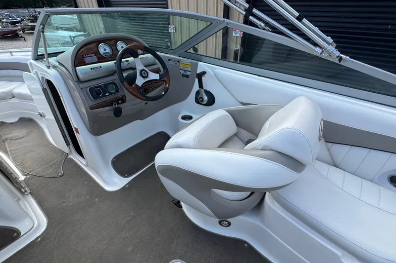 Slide: The Image of 2007 Kayot Z 220 boat interior with steering wheel and white seating. - 8