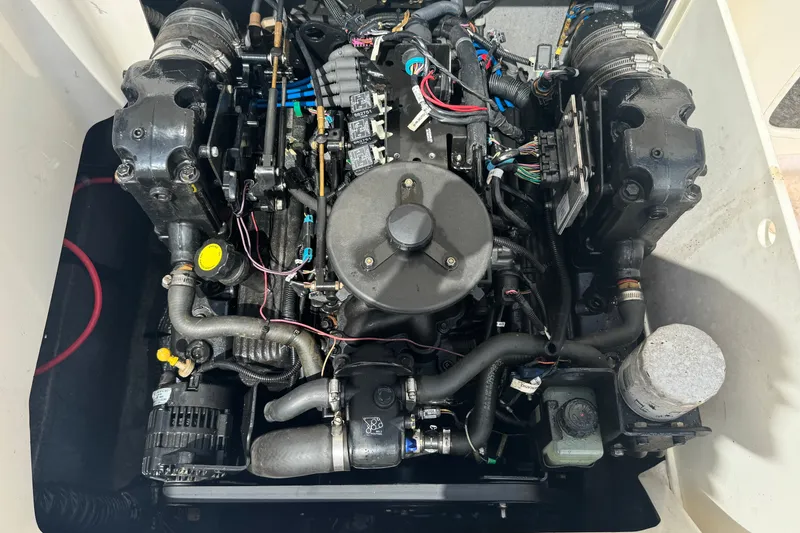 Slide: The Image of Engine of a 2007 Kayot Z 220 boat, showcasing intricate wiring and components. - 14