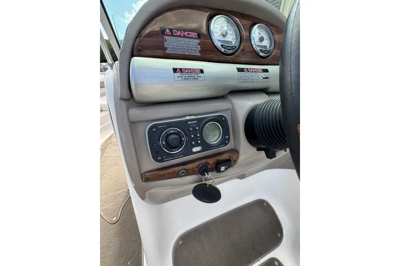 Slide: The Image of 2007 Kayot Z 220 boat dashboard with gauges and Sony stereo system. - 10
