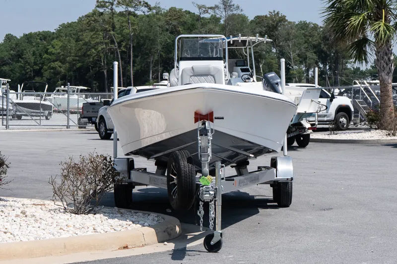 Slide: The Image of 2027 Blazer PureBay 2400 boat on trailer in marina parking lot. - 3