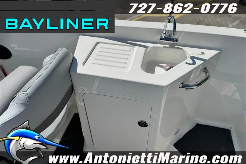 Slide: The Image of Bayliner D22 boat interior with sink and storage, 2026 model, Antonietti Marine contact details. - 25