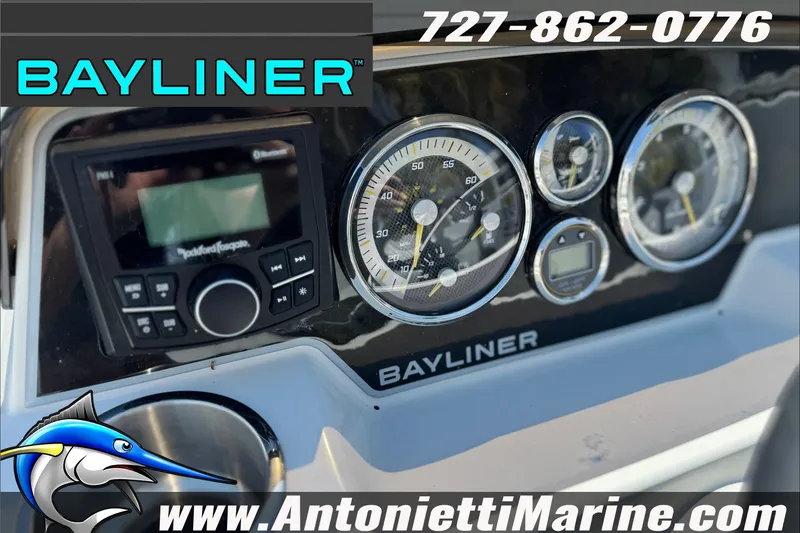 Slide: The Image of Dashboard of 2026 Bayliner D22 boat with gauges and Rockford Fosgate stereo. - 16