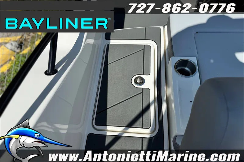 Slide: The Image of Bayliner D22 boat interior with storage compartment and cup holder, 2026 model. - 28