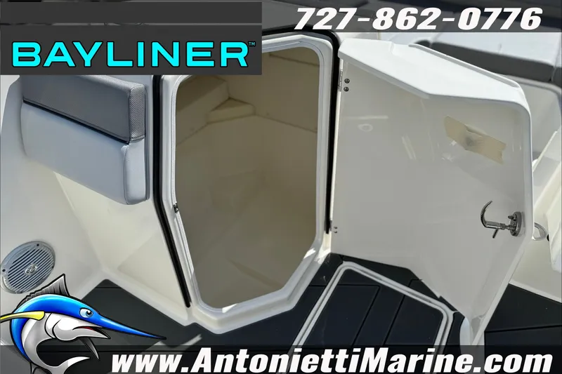Slide: The Image of 2026 Bayliner D22 boat interior with open cabin door, featuring sleek design and modern amenities. - 21
