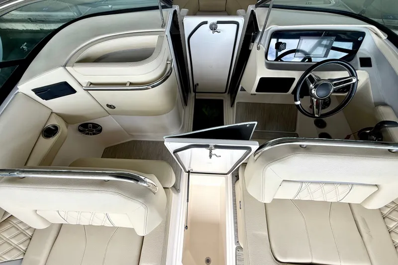 Slide: The Image of Interior of a 2019 Regal LS6 boat featuring luxurious seating and modern dashboard. - 29