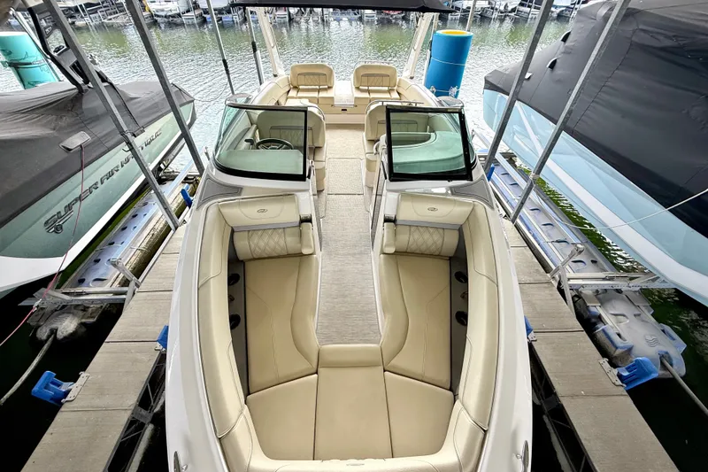 Slide: The Image of 2019 Regal LS6 boat docked, featuring spacious seating and elegant design. - 15