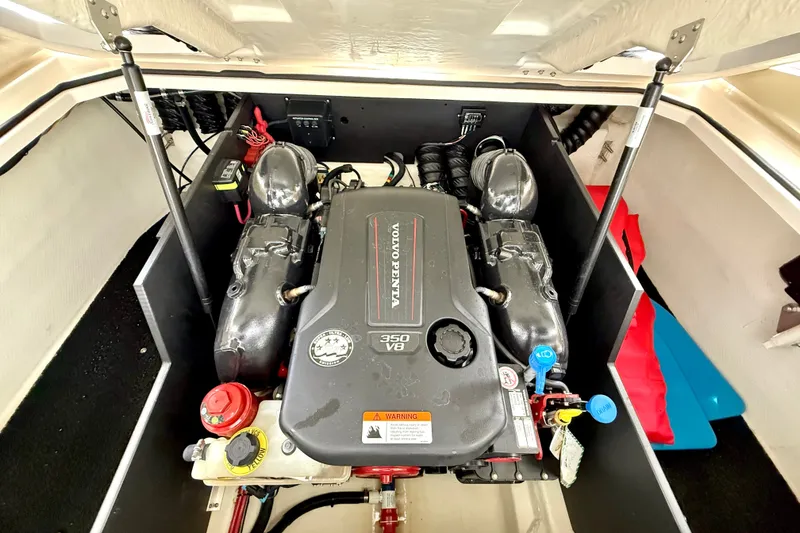 Slide: The Image of Engine compartment of a 2019 Regal LS6 boat featuring a Volvo Penta 350 V8 engine. - 35