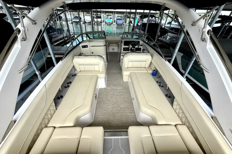 Slide: The Image of Luxurious 2019 Regal LS6 boat interior with beige seating and modern design. - 14
