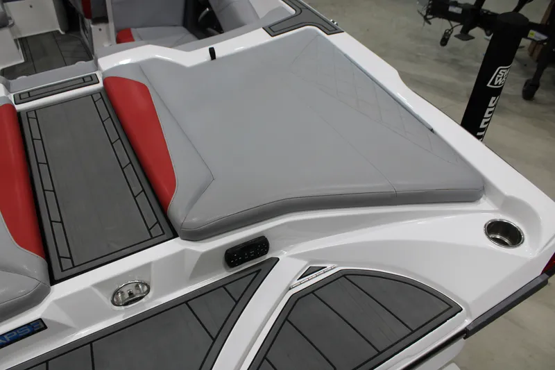 Slide: The Image of 2017 Tigé Z3 boat interior with gray and red seating, cup holder, and sleek design. - 17