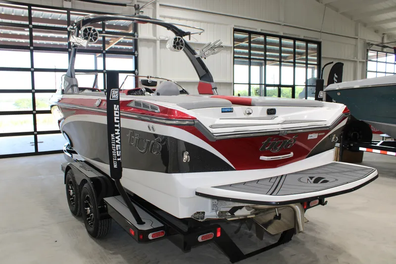 Slide: The Image of 2017 Tigé Z3 boat in showroom, featuring sleek design and vibrant colors. - 19
