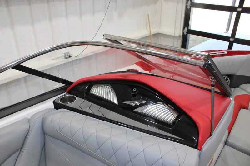 Slide: The Image of Interior of a 2017 Tigé Z3 boat with red and gray upholstery. - 15