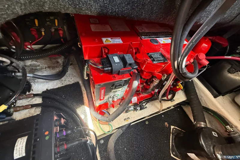 Slide: The Image of Engine compartment of 2023 Regal 26 XO boat with red machinery and wiring. - 37