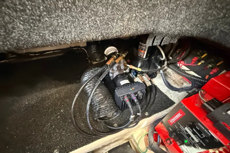 Slide: The Image of Engine compartment of 2023 Regal 26 XO boat with visible wiring and components. - 39